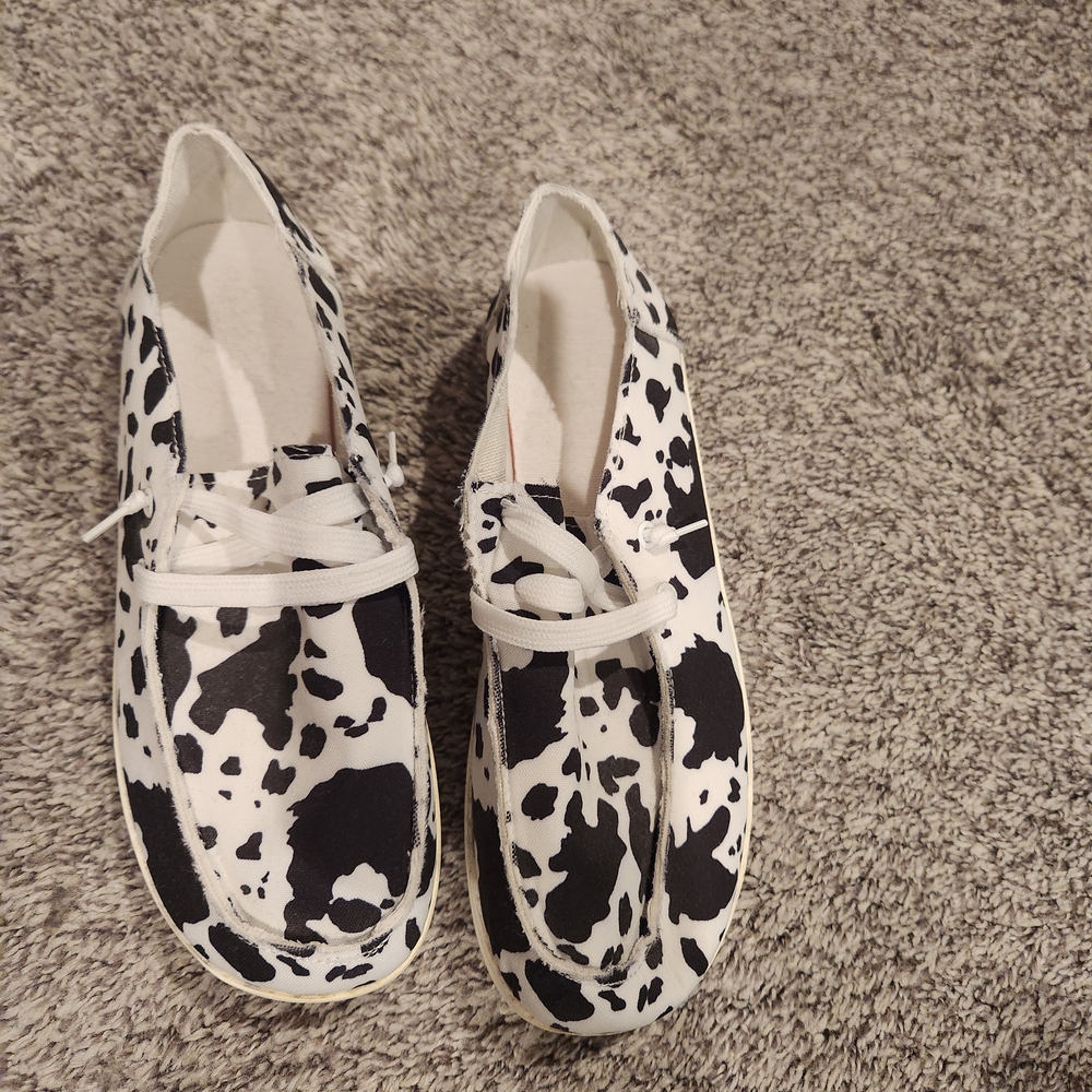 New. Black and White Cow Print Slip on shoes